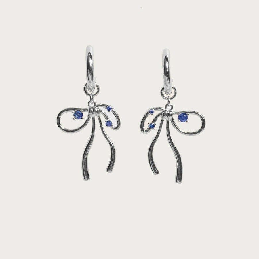 A Pair Of Silver Earrings