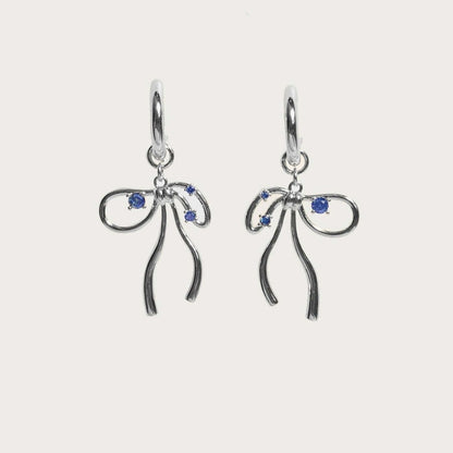 A Pair Of Silver Earrings