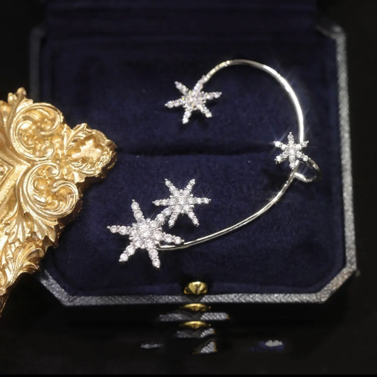Silver snowflake left ear