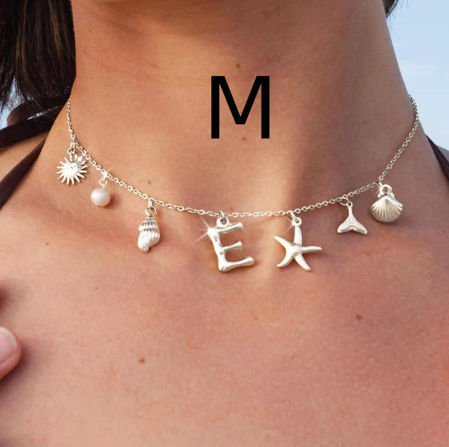 Silver letter M